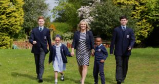 Mrs Ania Hildrey centre with Abbots Lea School students photo taken pre COVID 19 Liverpool school selected for Ofsted pilot