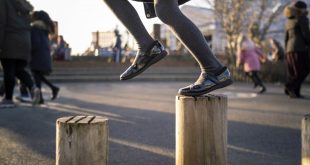 little girl playing in the school yard Improving the financial and operational health of UK schools